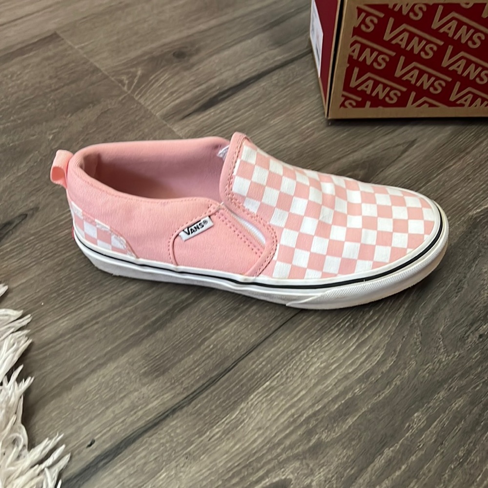 Checkerboard powder pink and white slip on shoes.
